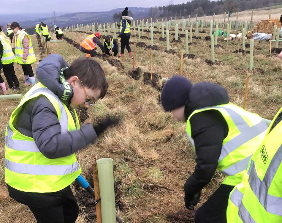 Children from St Patrick’s Primary School in Dipton planting trees at the Bradley site